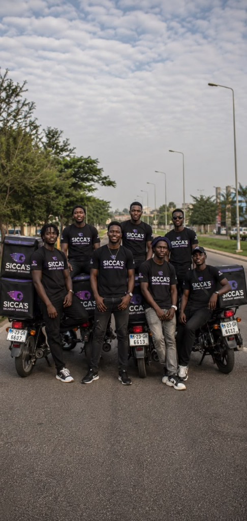 The SICCA'S delivery rider team standing professionally with their motorcycles in a row.
